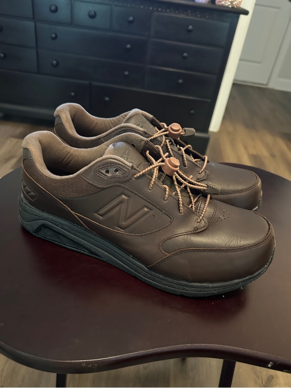 New Balance Men's Dark Brown Leather Comfort Sneakers with custom laces.